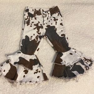 Boutique cow print bell bottoms
